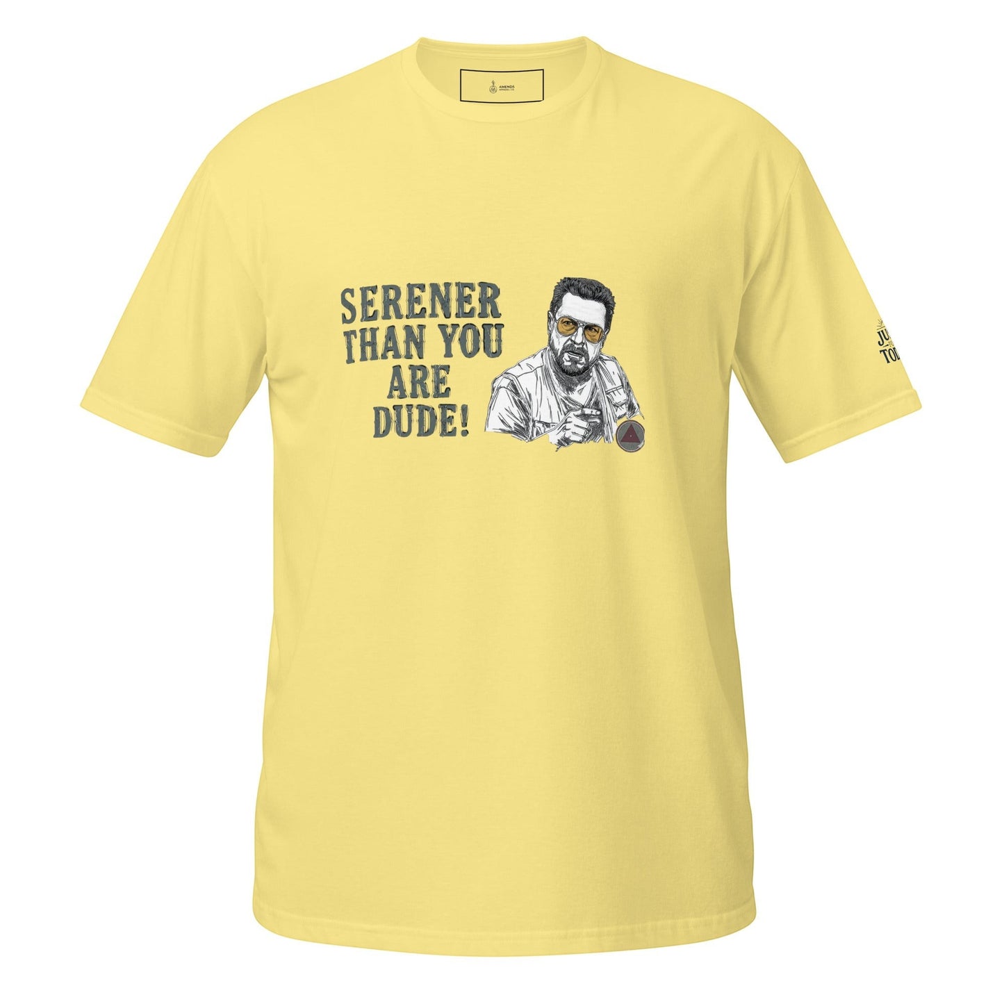 AmendsApparelCo light yellow 100% ring-spun cotton t-shirt with a graphic of Walter Sobchak and the text "Serener Than You Are Dude!"